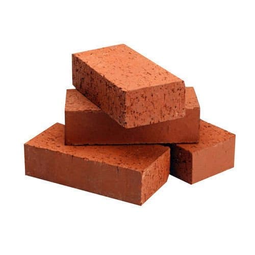 Stacked red clay bricks supplied by Kuriyal Suppliers
